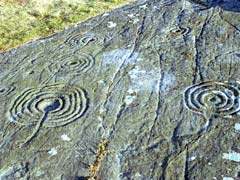 Expanse of cup and ring marked rock