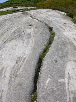 Long and deep groove running through the middle of a large expanse of rock
